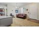 Cozy flex room with a leather couch, desk, and abundant natural light, perfect for work or study at 11732 W Foothill Dr, Sun City, AZ 85373