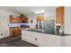 Modern kitchen featuring stainless steel appliances, granite countertops, and ample cabinet space at 11732 W Foothill Dr, Sun City, AZ 85373