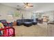 Large living room featuring plush seating, natural light, and an open layout for entertaining at 11732 W Foothill Dr, Sun City, AZ 85373