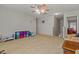 Comfortable living room with neutral walls, carpet, and easy access to the stairway at 11732 W Foothill Dr, Sun City, AZ 85373