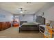 Main bedroom featuring gray walls, carpet flooring, and comfortable furnishings at 11732 W Foothill Dr, Sun City, AZ 85373
