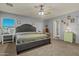 Main bedroom featuring gray walls, carpet flooring, and comfortable furnishings at 11732 W Foothill Dr, Sun City, AZ 85373