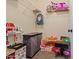 Walk-in closet with white shelving and a collection of ' toys and accessories at 11732 W Foothill Dr, Sun City, AZ 85373