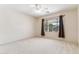 Empty bedroom with carpet, ceiling fan and natural light from window at 1245 E Waterview Pl, Chandler, AZ 85249