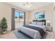 Staged bedroom with ceiling fan, natural light, and decorative artwork at 1245 E Waterview Pl, Chandler, AZ 85249