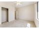 Bedroom featuring neutral walls and carpet, a ceiling fan and closet at 1245 E Waterview Pl, Chandler, AZ 85249
