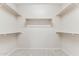 Walk-in closet with carpet and open shelving units at 1245 E Waterview Pl, Chandler, AZ 85249