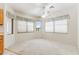 Bright dining area with neutral carpet, ceiling fan, and sunny windows at 1245 E Waterview Pl, Chandler, AZ 85249