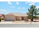 Charming single-story home featuring a tile roof, desert landscaping, and a two-car garage on a sunny day at 1245 E Waterview Pl, Chandler, AZ 85249