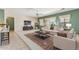Staged living room featuring neutral walls, plush carpet, modern furniture, and an elegant area rug at 1245 E Waterview Pl, Chandler, AZ 85249