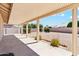 Covered patio area with concrete flooring looking out to the backyard at 1245 E Waterview Pl, Chandler, AZ 85249