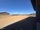 A dirt backyard showcasing desert view and iron fence at 13382 E Sand Hills Rd, Scottsdale, AZ 85255