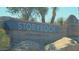 Community entrance sign for Storyrock set amidst desert vegetation and rock formations at 13382 E Sand Hills Rd, Scottsdale, AZ 85255