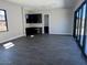 An open concept living room with sliding glass doors, dark wood flooring, and black cabinets at 13382 E Sand Hills Rd, Scottsdale, AZ 85255
