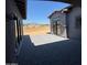 Covered patio area with gray pavers, offering an inviting outdoor space and views of the property at 13382 E Sand Hills Rd, Scottsdale, AZ 85255