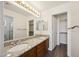 Bathroom features a double sink vanity, granite countertops, and ample lighting at 13416 S 47Th St, Phoenix, AZ 85044