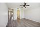Spacious bedroom featuring a ceiling fan and wood-look flooring at 13416 S 47Th St, Phoenix, AZ 85044