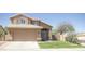 Charming two-story home featuring a tile roof, well-maintained lawn, and inviting curb appeal at 13416 S 47Th St, Phoenix, AZ 85044