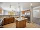 Open concept kitchen with stainless steel appliances, granite counters, and tile flooring at 13416 S 47Th St, Phoenix, AZ 85044