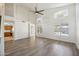 Spacious living room featuring tall windows and wood flooring at 13416 S 47Th St, Phoenix, AZ 85044