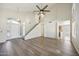 Bright and airy living room with high ceilings, wood floors, and a staircase at 13416 S 47Th St, Phoenix, AZ 85044