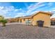 Backyard showing solar panels and a gravel landscape design for low maintenance and eco-friendly living at 136 N 236Th Ave, Buckeye, AZ 85396
