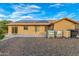 Backyard with water storage tanks and solar panels for efficient water and energy use at 136 N 236Th Ave, Buckeye, AZ 85396