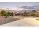 Spacious backyard featuring desert landscaping, stone accents, and a covered patio area at 136 N 236Th Ave, Buckeye, AZ 85396