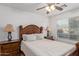 Traditional-style bedroom featuring a neutral color palette, two side tables and carpet at 136 N 236Th Ave, Buckeye, AZ 85396
