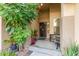Inviting front entrance with desert landscaping and a secure screen door at 136 N 236Th Ave, Buckeye, AZ 85396