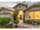 Inviting front entrance with desert landscaping and a secure screen door at 136 N 236Th Ave, Buckeye, AZ 85396