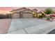Charming single-story home featuring a three-car garage and a well-maintained, xeriscaped front yard at 136 N 236Th Ave, Buckeye, AZ 85396
