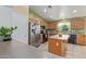 Well-equipped kitchen featuring an island, stainless steel refrigerator, and ample counter space at 136 N 236Th Ave, Buckeye, AZ 85396