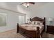 Spacious main bedroom featuring a decorative ceiling fan, carpet and neutral walls at 136 N 236Th Ave, Buckeye, AZ 85396