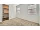 Cozy bedroom with plush carpet, neutral walls, and abundant natural light at 15760 W Pioneer St, Goodyear, AZ 85338