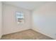 Bedroom with plush carpet, a window providing natural light, and neutral-colored walls at 15760 W Pioneer St, Goodyear, AZ 85338