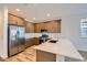 Well-equipped kitchen with stainless steel appliances, ample cabinets, and a large countertop at 15760 W Pioneer St, Goodyear, AZ 85338