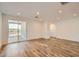 Spacious living area with sliding glass doors to the patio and wood-look flooring at 15760 W Pioneer St, Goodyear, AZ 85338
