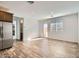 Bright living area with wood flooring and plenty of natural light from door to backyard at 15760 W Pioneer St, Goodyear, AZ 85338