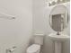 Bathroom features a pedestal sink at 16115 W Acacia Ct, Surprise, AZ 85374