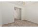 Neutral carpet and entry to walk-in closet featured in bedroom at 16115 W Acacia Ct, Surprise, AZ 85374