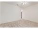 Neutral carpet and ceiling fan featured in bedroom with closet at 16115 W Acacia Ct, Surprise, AZ 85374