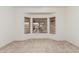 Bedroom featuring a bay window and neutral carpet at 16115 W Acacia Ct, Surprise, AZ 85374