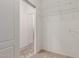 Walk-in closet with door and wire shelving at 16115 W Acacia Ct, Surprise, AZ 85374