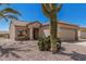 Charming single-story home with desert landscaping and attached garage at 16115 W Acacia Ct, Surprise, AZ 85374