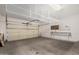 Spacious two car garage with shelving and overhead storage at 16115 W Acacia Ct, Surprise, AZ 85374