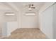 Living room featuring tile floors, ceiling fan and window blinds at 16115 W Acacia Ct, Surprise, AZ 85374