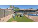 Backyard featuring a fire pit, pool, outdoor seating, and gravel ground cover at 1620 N 72Nd Ln, Phoenix, AZ 85035