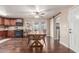 Open-concept dining area adjacent to a well-equipped kitchen and sliding glass doors at 1620 N 72Nd Ln, Phoenix, AZ 85035