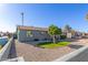 Cozy single-story home with a xeriscaped front yard and a well-maintained lawn at 1620 N 72Nd Ln, Phoenix, AZ 85035